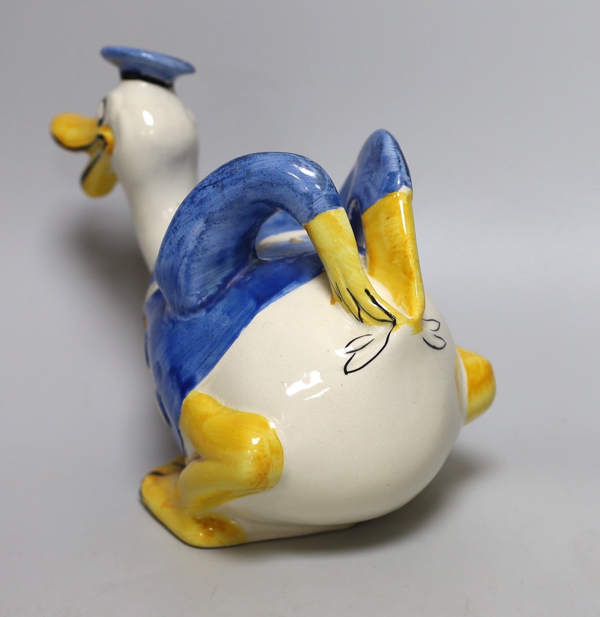 A Wade Heath Donald Duck teapot and cover, 22cms wide x 16.5cms high